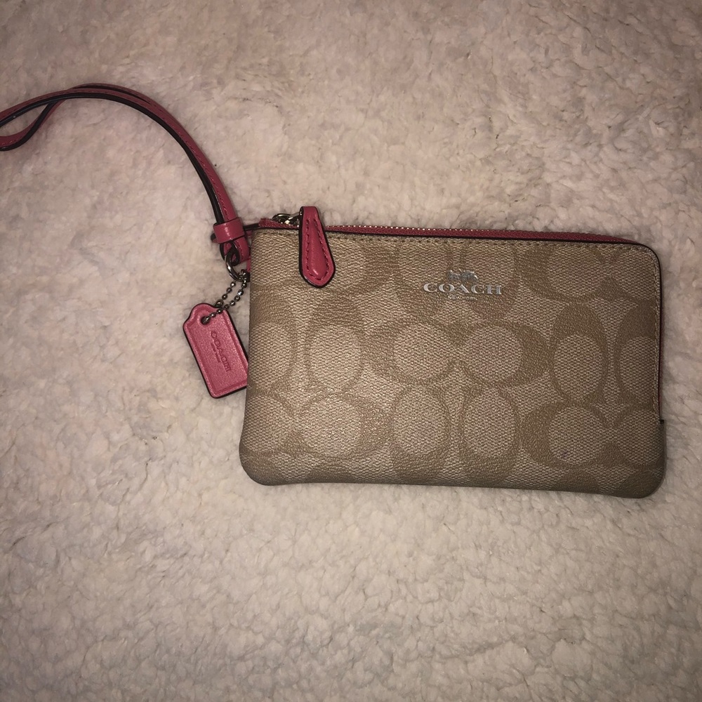 Bring anywhere Coach Wristlet!